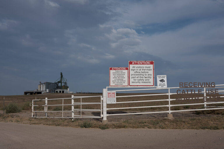 Photography by Isabelle Hayeur a Kansas feedlot with sign at entrance